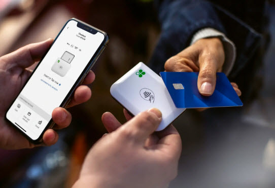 A dynamic composition of modern POS equipment, including sleek credit card terminals, PIN pads, and barcode scanners, set against a professional blue and silver backdrop.